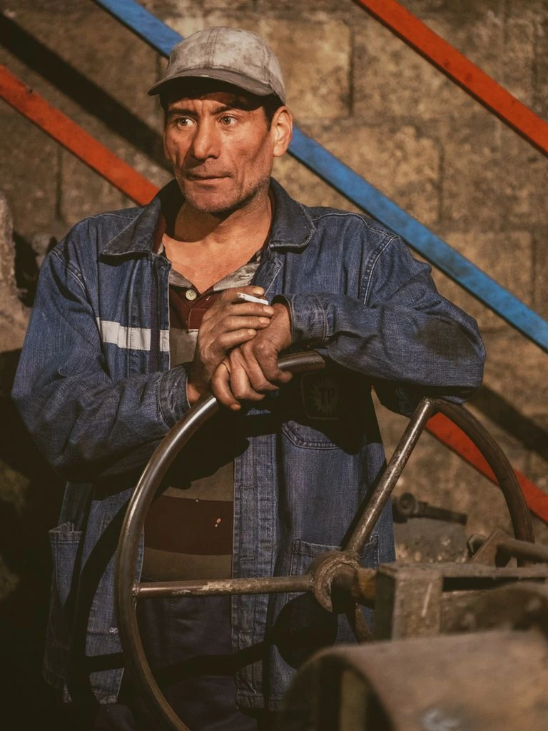 Tom Bakker inside a Maggot-P processing facility beside stainless-steel bioconversion equipment.